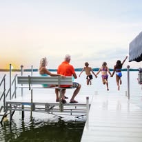 Family enjoying a day together on their dock