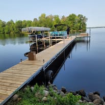 Long dock and boat lift system installed on a Wisconsin lake